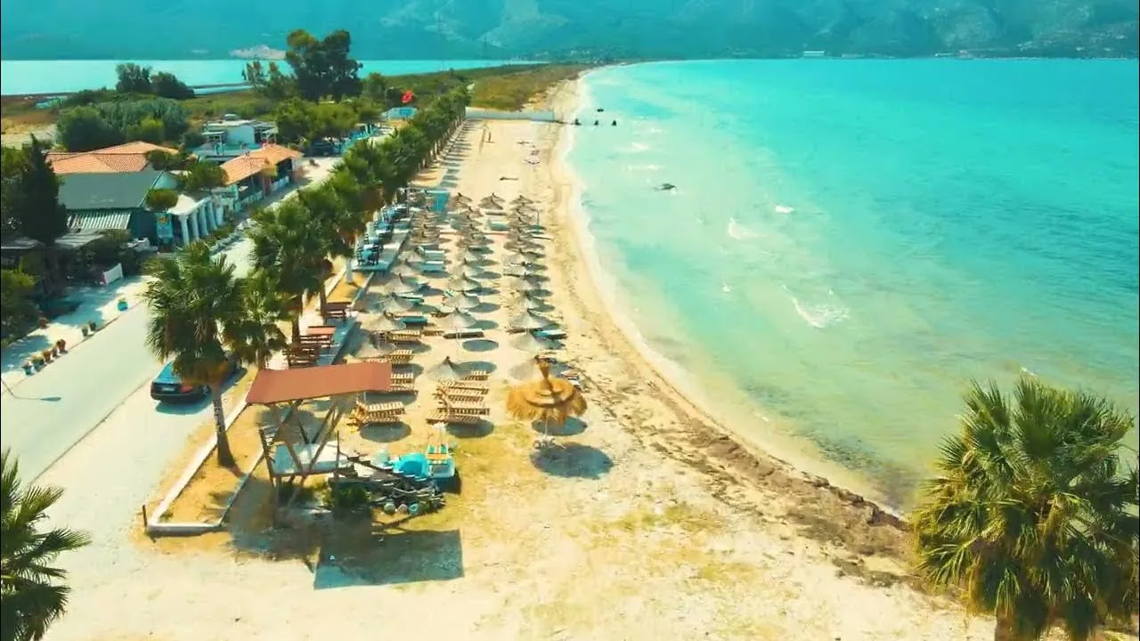 Pebble beach and calm blue water in Orikum, Albania