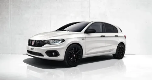 White Fiat Tipo hatchback with black wheels and a sleek design on a neutral background.