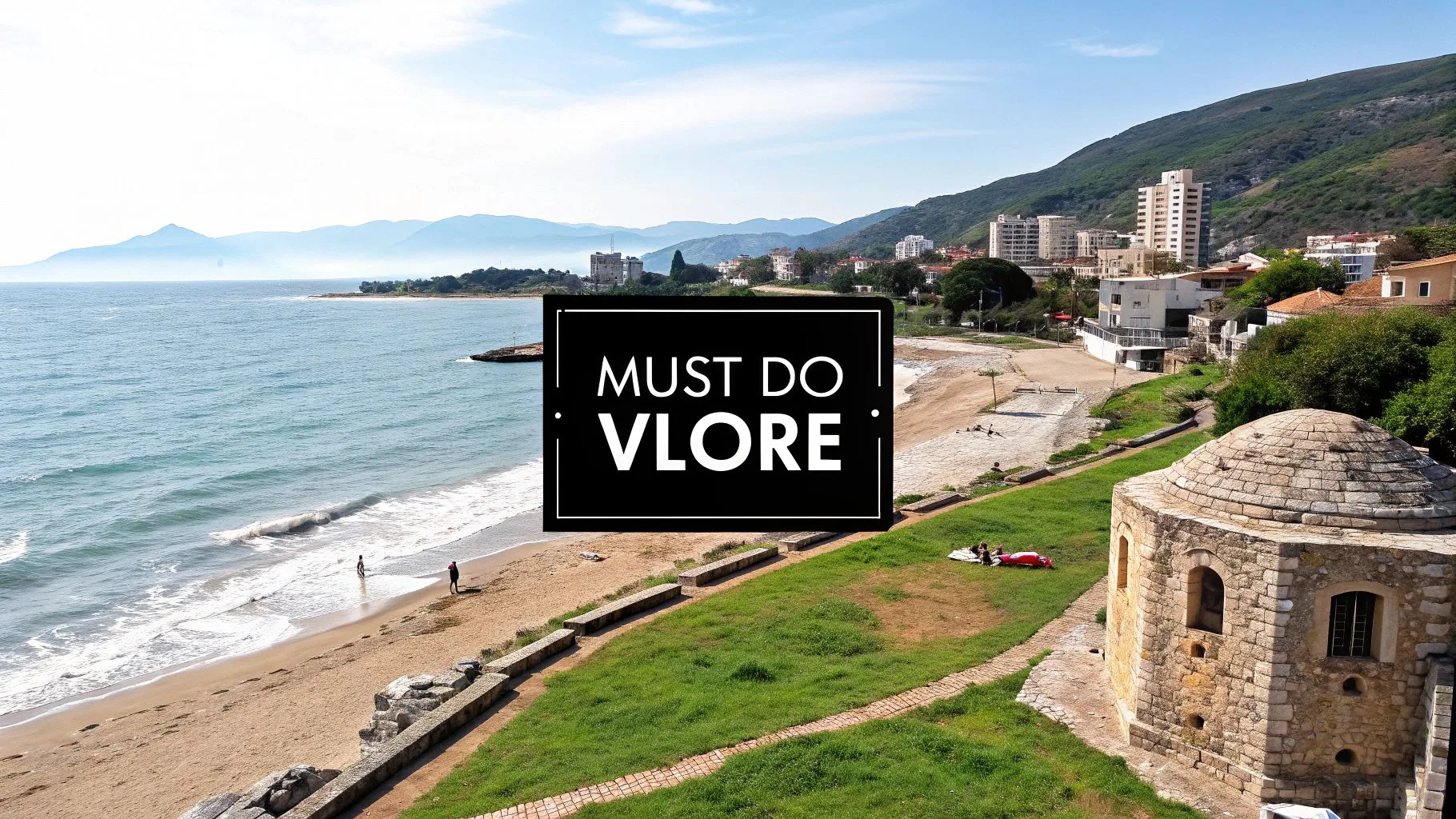 Scenic view of Vlore beach with mountains in the background and a historic structure in the foreground.